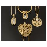 Four pendant gold tone necklaces