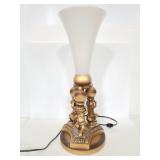 Cast metal cherub lamp with white glass shade