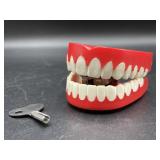 Chattering teeth wind up toy with key