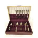 Set of stainless flatware in case for seven people