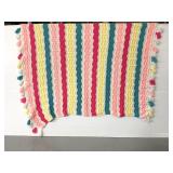 Vibrant colored striped throw blanket with tassels