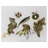 Gold toned brooch pin collection