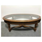 Oval wood glass topped coffee table