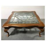 Large wood coffee table with glass top