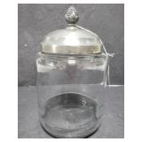 Glass jar with silver tone lid