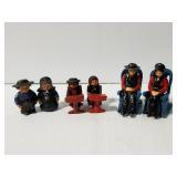 Three pairs cast iron Amish figure