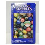 Unopened tin of marbles