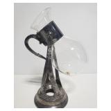 Vintage lrnate pitcher on metal stand