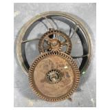 Large old industrial pulley wheel w/ gears