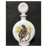 A Singer signed 1969 milk glass bobwhite decanter