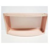 Pink metal shelf with poodle accents