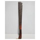 Old blacksmith machete with wood handle