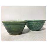 Two small green pottery bowls