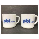 Two PBI schools Fire King mugs