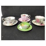 Four green & pink tea cups and saucers
