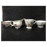 Two porcelain creamer and sugar sets