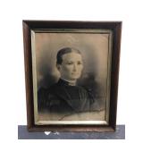 Antique framed portrait of a stern woman
