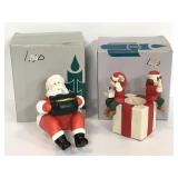 Two bisque porcelain Christmas tea light holders