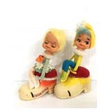 Pair of vintage rubber face pixie pin cushions