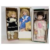 Three porcelain dolls with boxes