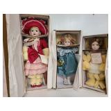Design Début porcelain doll trio in boxes