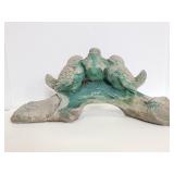 Cement birds on a branch statue
