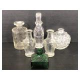 Six vintage small glass bottles
