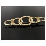 Vintage Monet gold tone knot brooch