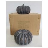 Two heavy stone like pumpkins