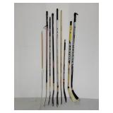Nine assorted hockey sticks