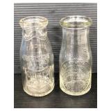 Two vintage glass 1/2 pint milk bottles