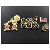 Gold tone pin and brioche collection