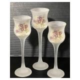 Three frosted glass stemmed tea light holders