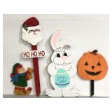 Four assorted holiday wood cut outs