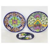 Trio of pottery floral decorative dishes