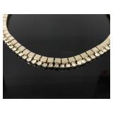 Gold tone jeweled necklace