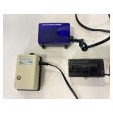 Three assorted filter and pump AC adapters