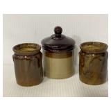 Three brown ceramic jars