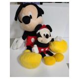Two big Mickey mouse stuffed animals