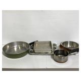 Six assorted cooking pans and baking sheets