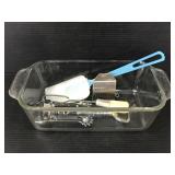 Assorted kitchen items in Pyrex loaf pan