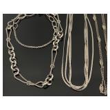 Trio of silver toned statement necklaces