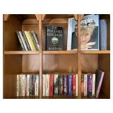 Books on top two shelves, mostly paperback