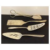 Four ornate serving utensils