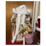 Santa Claus tree topper with pink bag