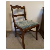 Vintage wooden dining chair with carved top