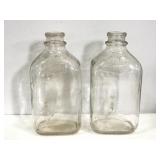Pair of Vintage United dairies milk bottles