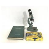 Vintage microscope, slides and book