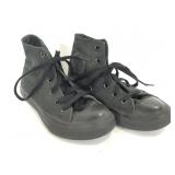 Black high top Converse Chuck Taylors shoes