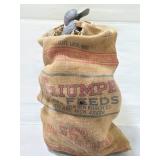 Triumph burlap sack of decoy ducks